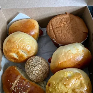 Assorted buns, mochi sesame ball, and paper cake