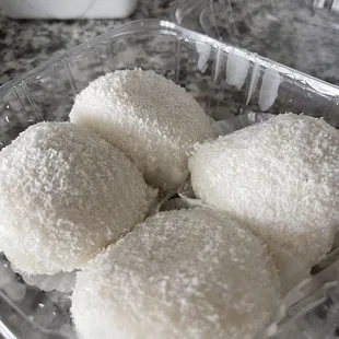 Chewy coconut-dusted &quot;snowballs&quot; filled with sugared peanuts... so delish! My mom&apos;s fav