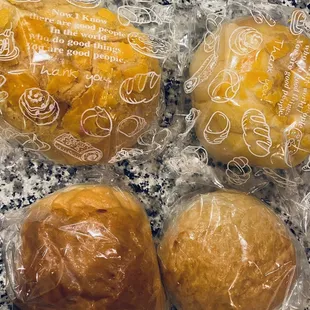 three buns wrapped in plastic