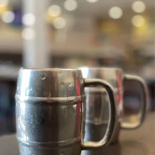 three beer mugs on a table