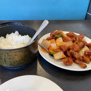 Lunch special sweet and sour pork. It&apos;s a full size portion with a container of rice.