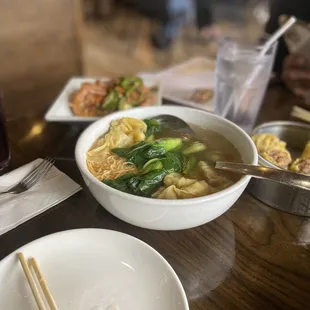 a bowl of soup and chopsticks