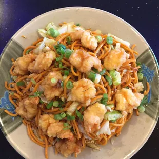 a plate of noodles and shrimp