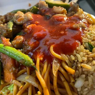 Combo #2 Chicken &amp; green bean / zucchini chicken with their special hot sauce poured on top.