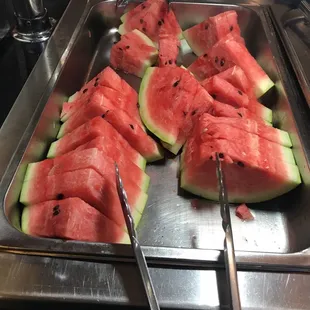 a tray of watermelon slices
