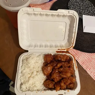 chicken and rice in a styrofoam container