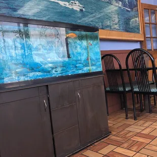 a fish tank and chairs