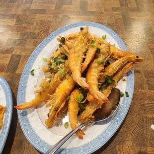two plates of prawers and a spoon