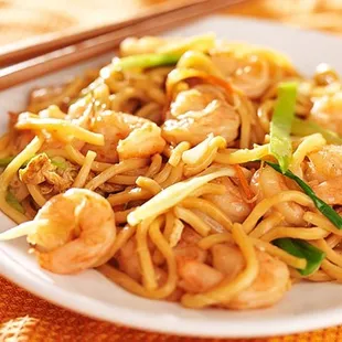 a plate of noodles and shrimp