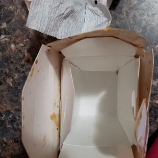Mouse poop (on napkin) was at the bottom of the rice. Prior to me throwing it away, it was very distinctively a dropping.