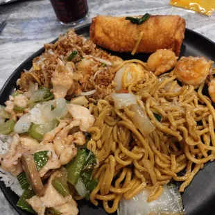 Egg roll , mushroom fried rice, shrimp vegetable yee mein, chicken with almond.