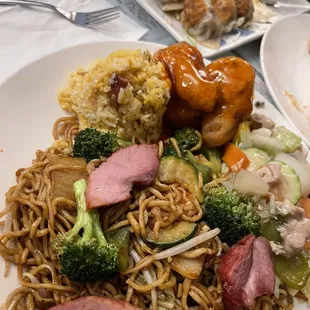 $10.50 Combination plate with Pot Stickers in the background.