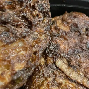 a close up of fried fish in a frying pan