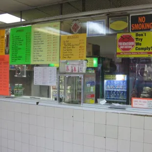 the front counter (behind a plexiglass barrier)