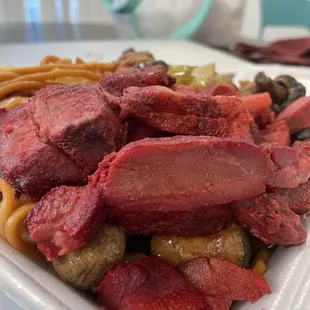 meat and noodles in a styrofoam container