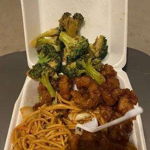 noodles, broccoli and meat in a styrofoam container