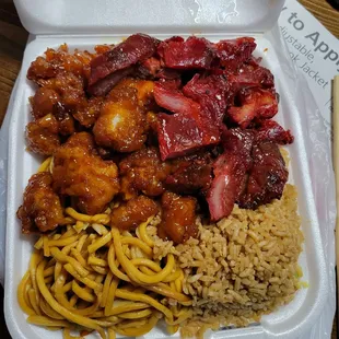 Combo C: Half fried rice and half chow mein with orange chicken and BBQ pork.