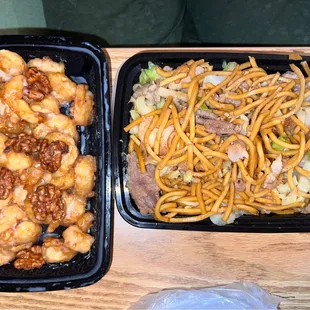 two trays of chinese food