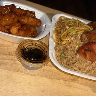 Combo Plate C 3 item with Orange Chicken, teriyaki chicken and sweet and sour chicken. Half chow mein and fried rice.