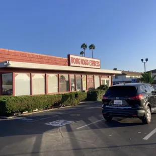 a car parked in front of a restaurant