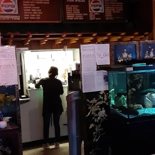 a restaurant with a fish tank