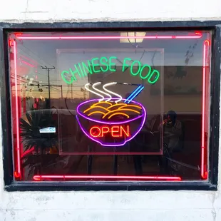 a neon sign in a window