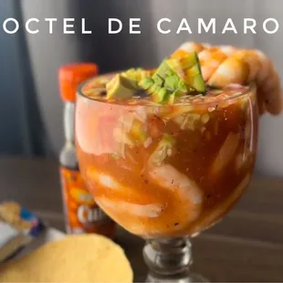 a cocktail with shrimp and vegetables