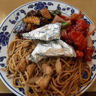 Combination plate C: Szechuan Beef, Sweet and Sour Pork, Chicken Chow Mein and Paper Chicken. (Succulent dark meat in the packets.)