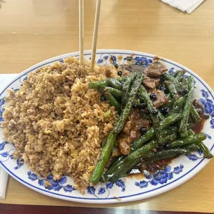 Half eaten beef &amp; green bean. Portion size is crazy big