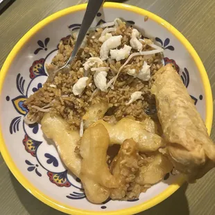 Sweet and sour chicken with chicken fried rice and an egg roll