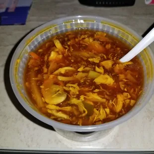 Hot and sour soup with tofu, mushroom, scallions. Very good