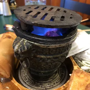 a stove with a blue flame