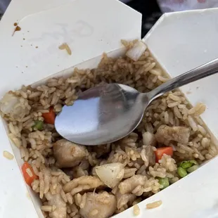 rice and chicken in a take out box