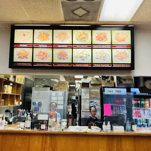 a restaurant counter and menus
