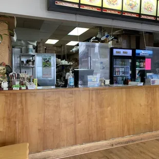 a restaurant counter with a television