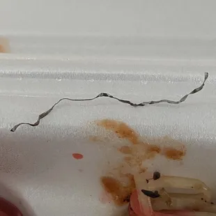 A piece of metal hiding in between the chow mein