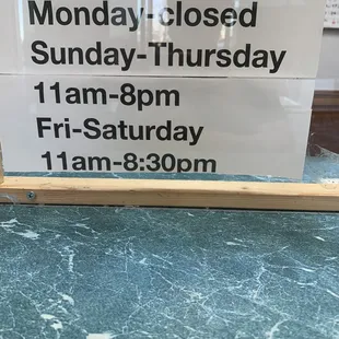 a business hours closed sign in a window