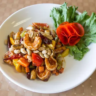 a plate of food with lettuce and tomatoes