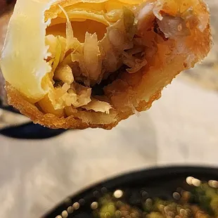 a person holding a piece of food