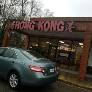 a car parked in front of a restaurant