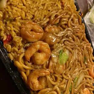 a close up of a plate of noodles and shrimp