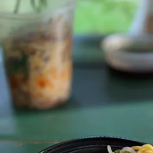 In the foreground: 凉面 A18. Chengdu Spicy Cold Noodles In the background: 担担面 A20. Dan Dan Noodle