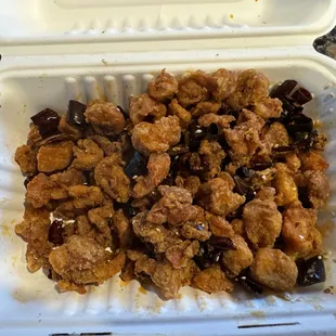 Bone-dry and overly fried chicken skin pieces with hunks of red pepper. They call it "Diced Chicken with Hot Peppers."