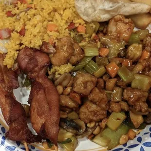 Fried rice dumplings spring rolls teriyaki chicken on a stick