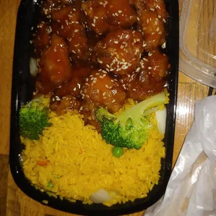 Sesame chicken &amp;rice with egg roll.