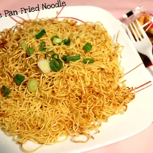 a plate of noodles and a fork