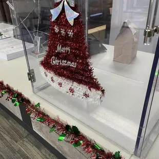 a christmas bell in a display case