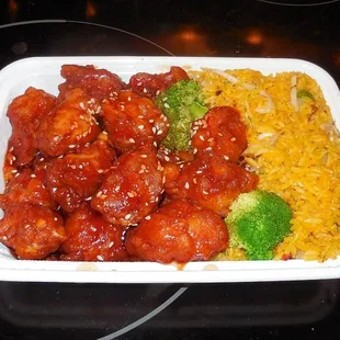 Their orange chicken is tasty but I will never understand the yellow &quot;fried rice.&quot;