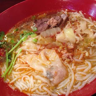 Mild spicy rice noodles with wontons and five spice beef. Wonton stuffing was weird. V spicy noodles but good. Broth only spicy