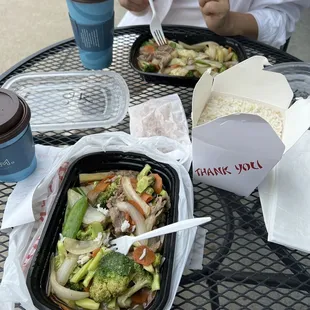 Stir fry veggies with beef and rice .